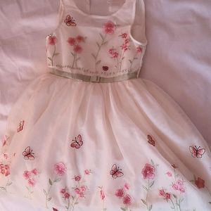 Yellow girls dress with pink flowers and butterflies